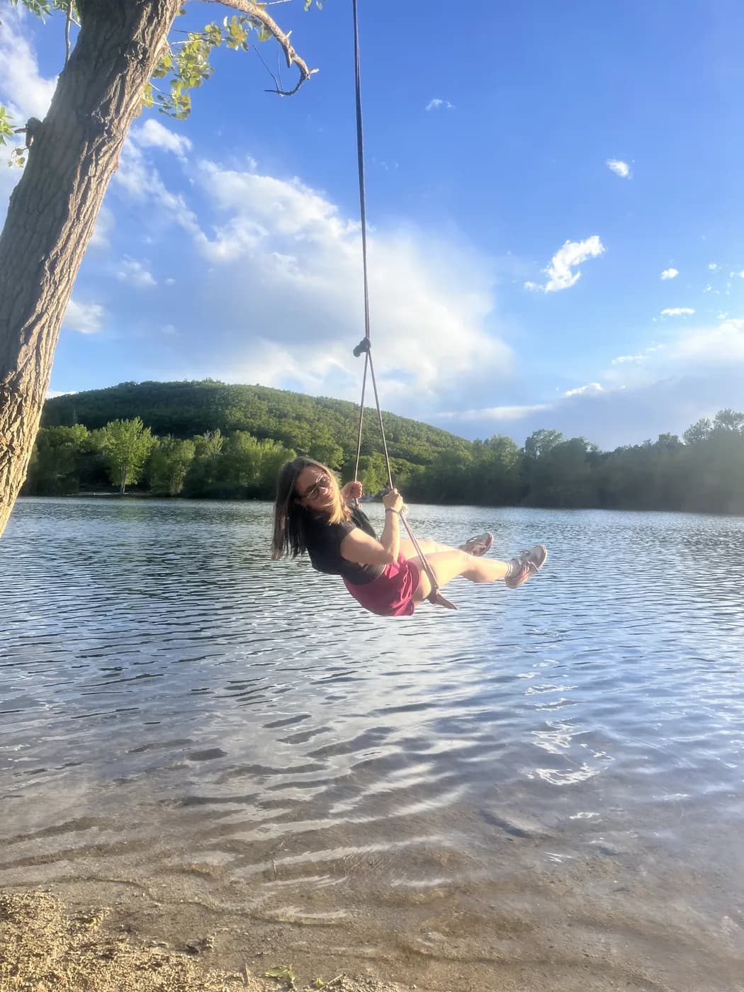 Syd on a rope swing over a lake