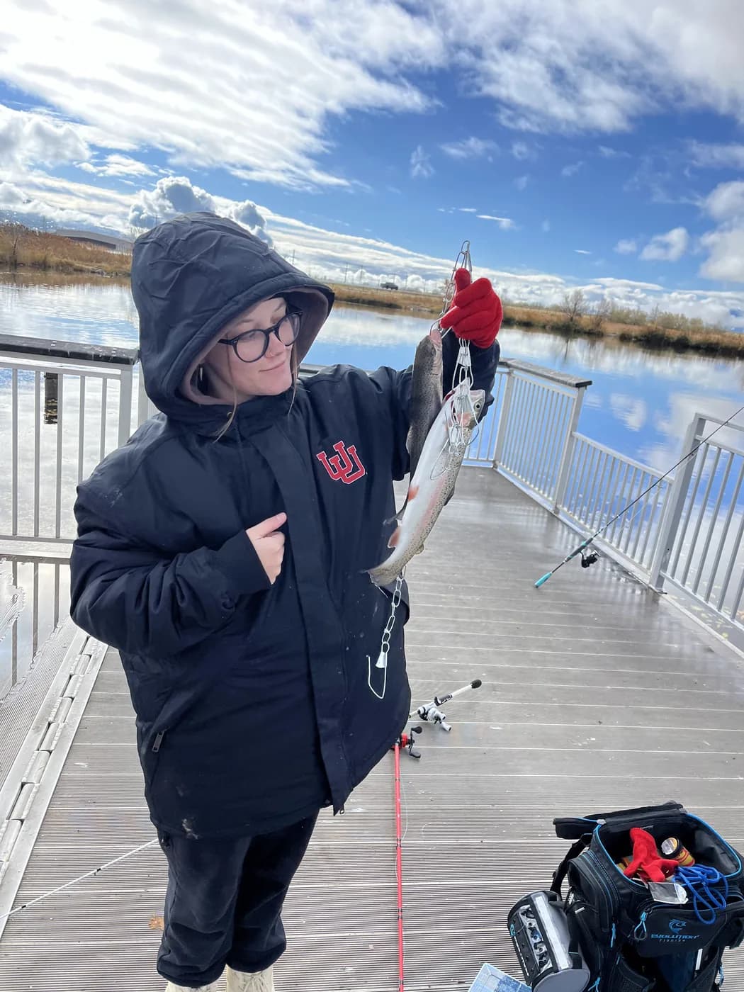 Syd holding a fresh catch out on the dock